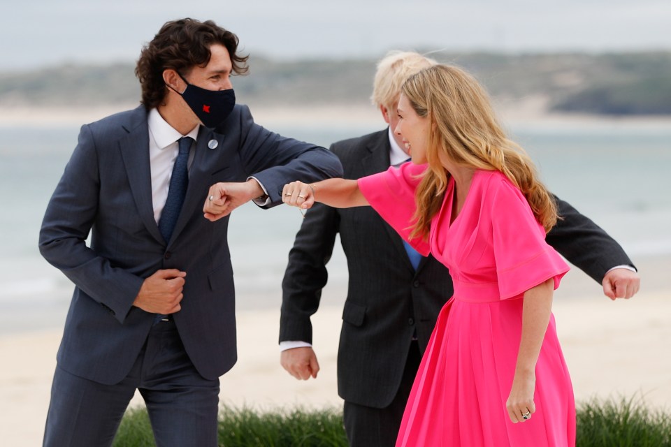 Carrie Johnson and Canadian PM Justin Trudeau have an enthusiastic elbow bump