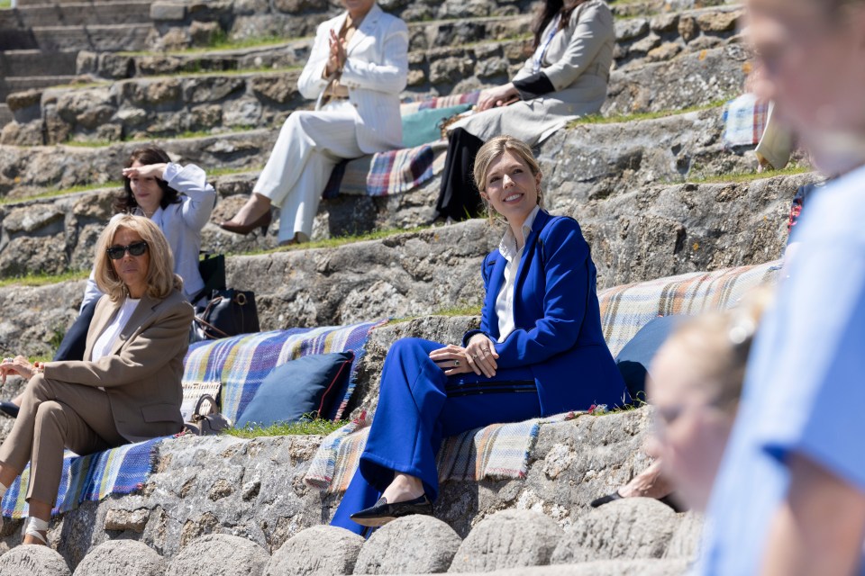 Carrie Johnson and Brigitte Macron watch a performance of ‘Ocean World’