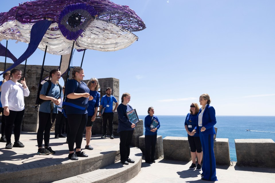 Carrie Johnson and US First Lady Dr Jill Biden speak with performers