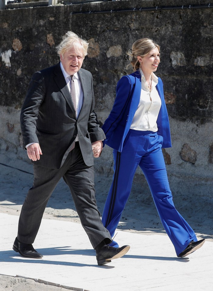 Carries bold blue suit was also one of her bargain rentals costing £160 to hire rather than £990 to buy