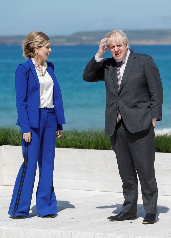 Prime Minister Boris Johnson and his wife Carrie wore suits despite the heat