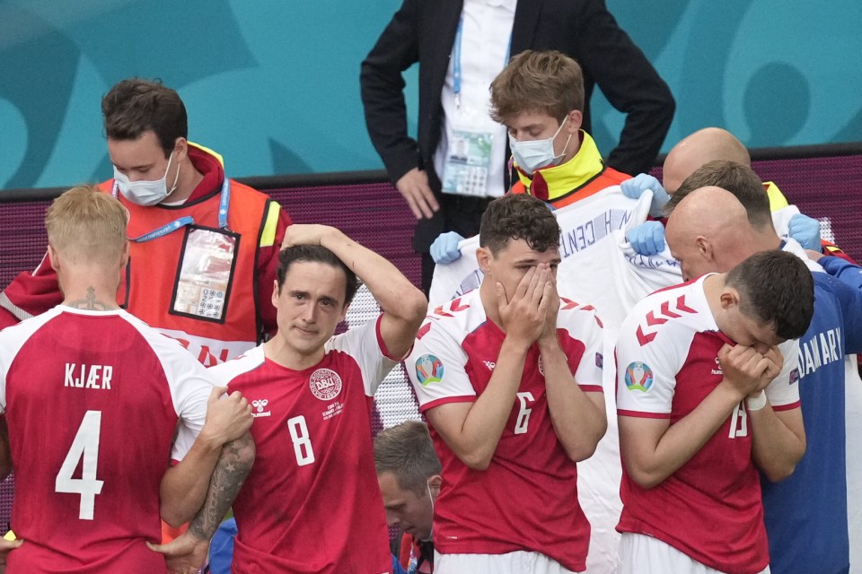 Distraught Danish players formed a circle around Eriksen after he collapsed