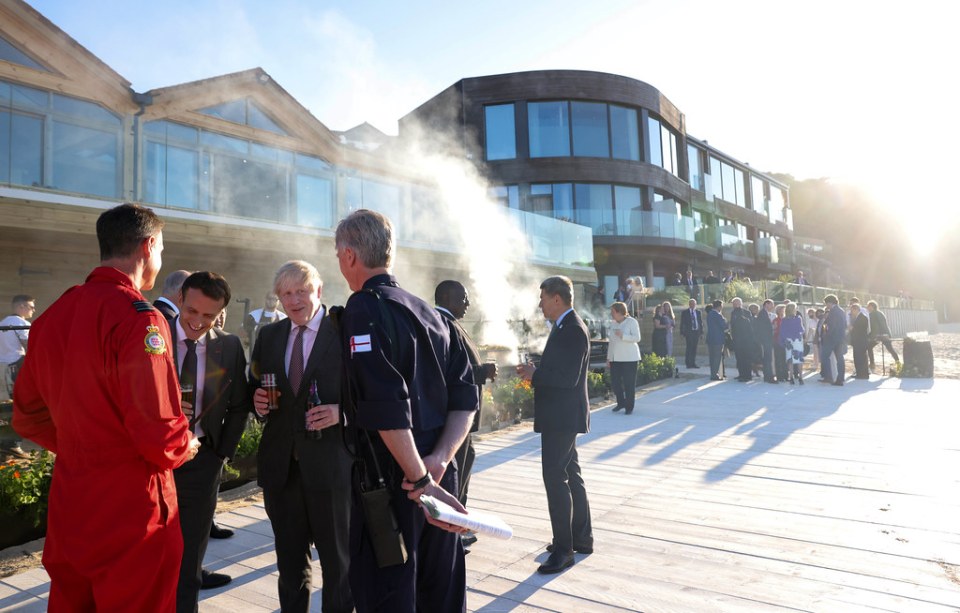 Boris Johnson with French president Emmanuel Macron and a Red Arrows pilot