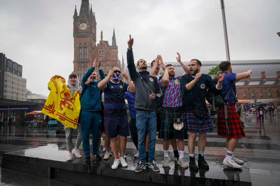 Fans sing and chant at King's Cross