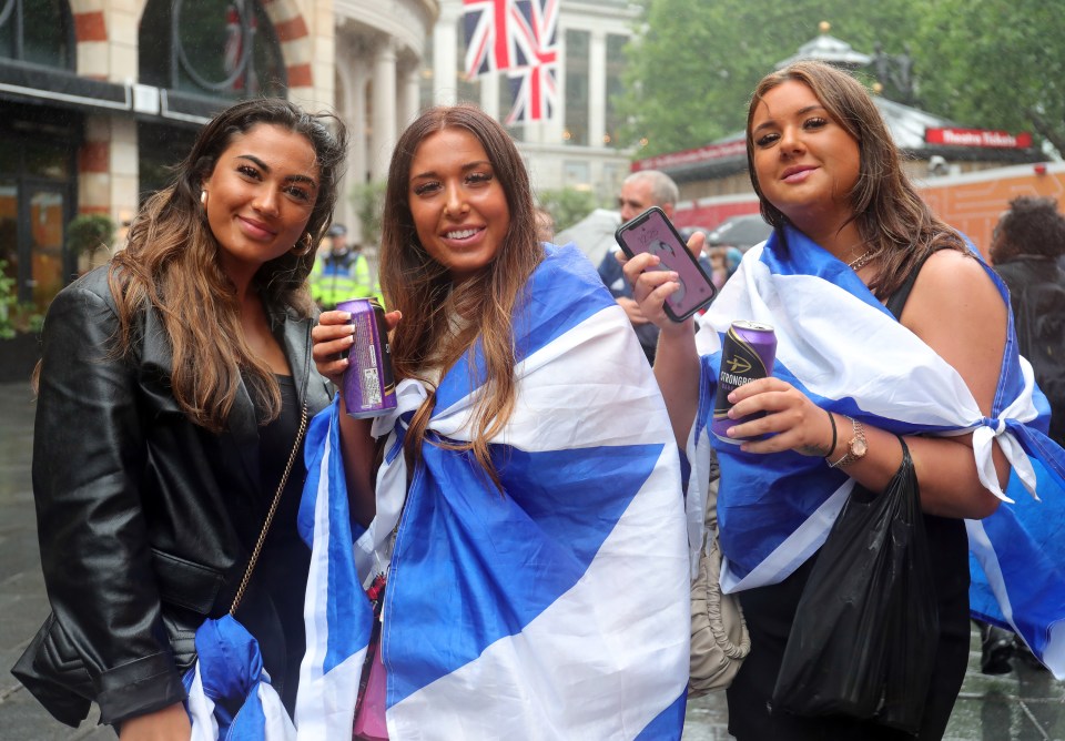 Scottish fans draped in flags in London yesterday