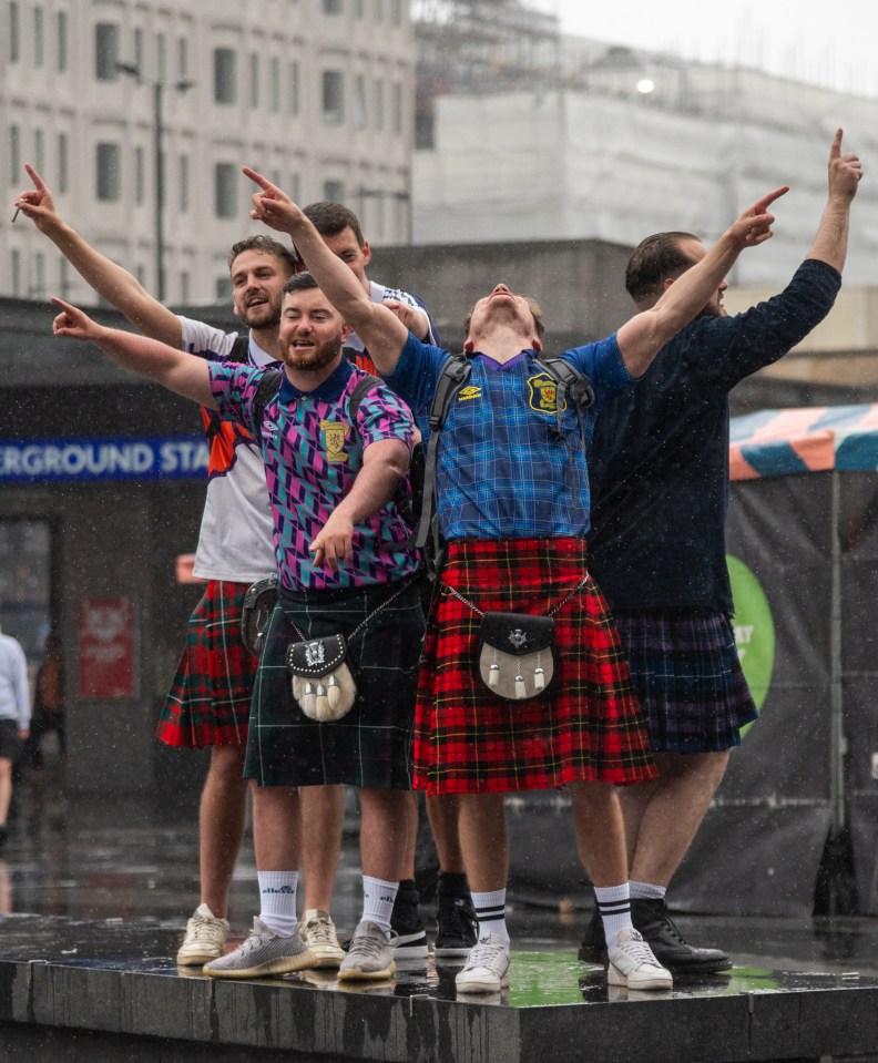 Football fans in kilts singing in London today