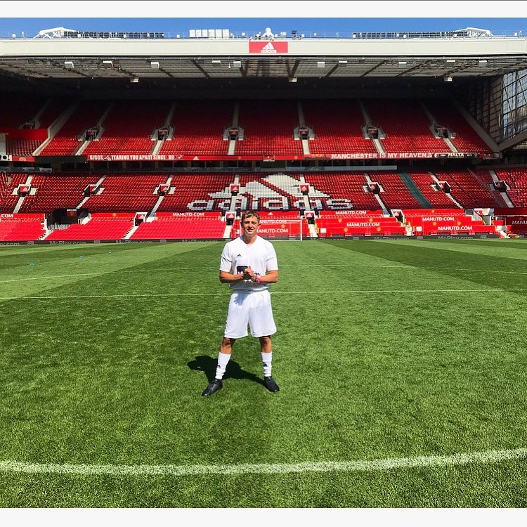 George, pictured at Old Trafford, had 'Lineker, 10' on the back of his shirt