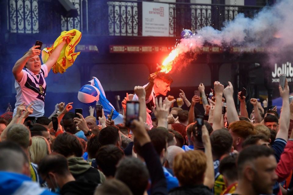 Crowds held flares in anticipation for the matc