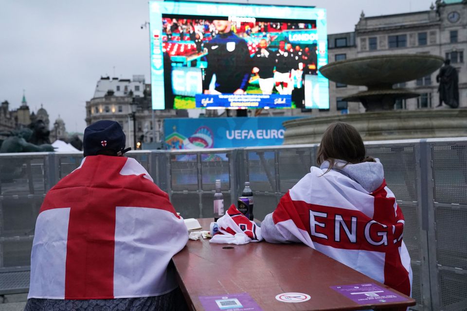 Key workers watching the match from Trafalgar Square, London