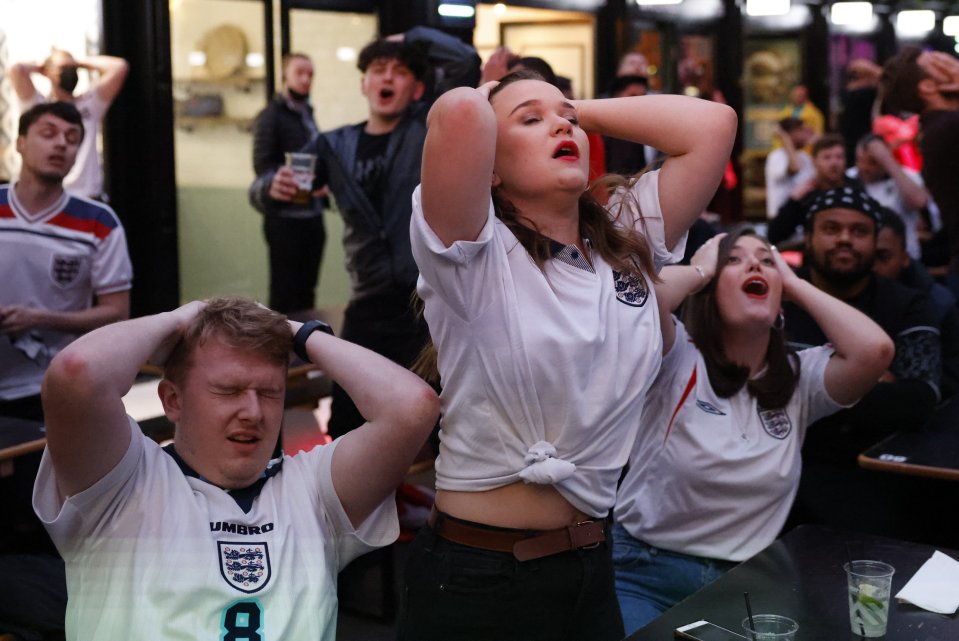 Disgruntled fans react after a goal-less game