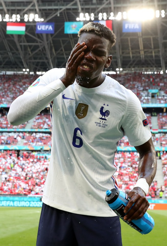 Paul Pogba takes a breather from the scorching conditions