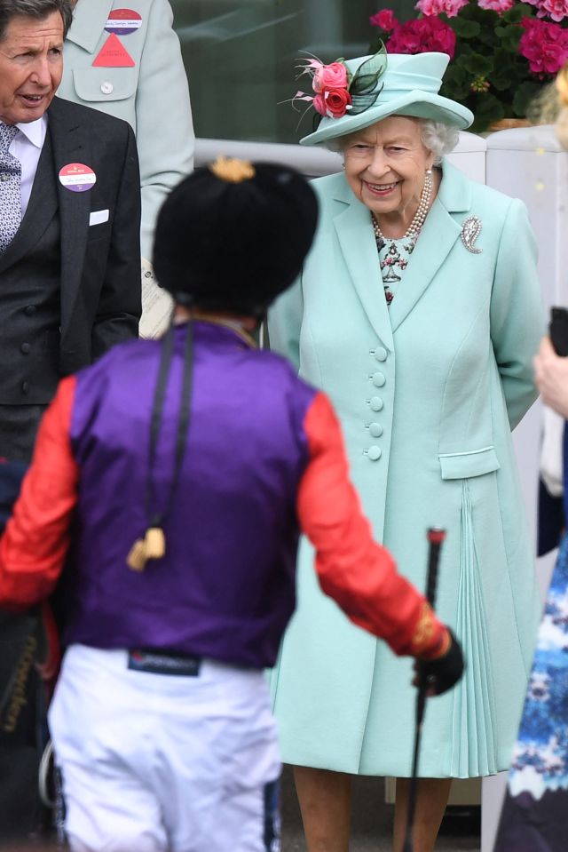 Her Majesty was all smiles as she chatted to Dettori