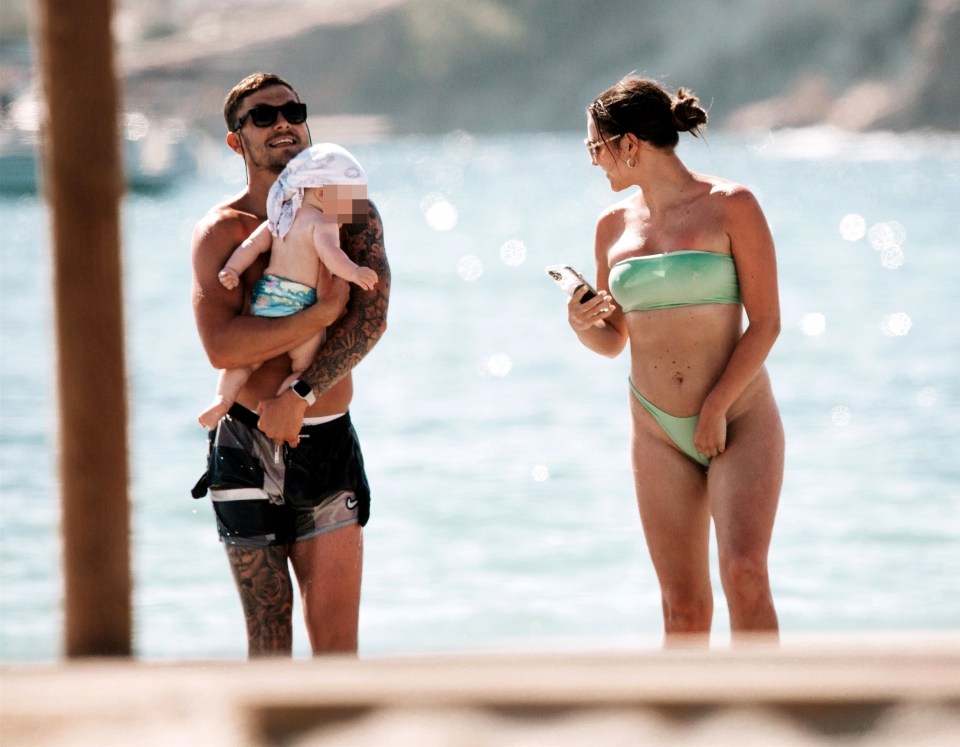 The couple went for a walk along the beach with their son