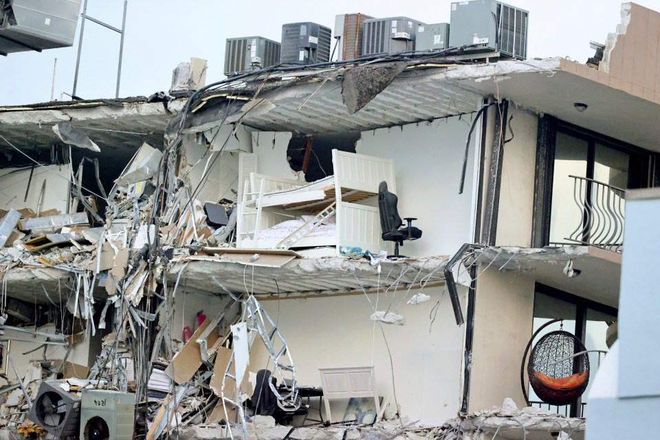 Homes were destroyed as part of the condo crashed to the ground