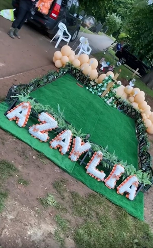 The memorial featured a flower display spelling out his late daughter's name