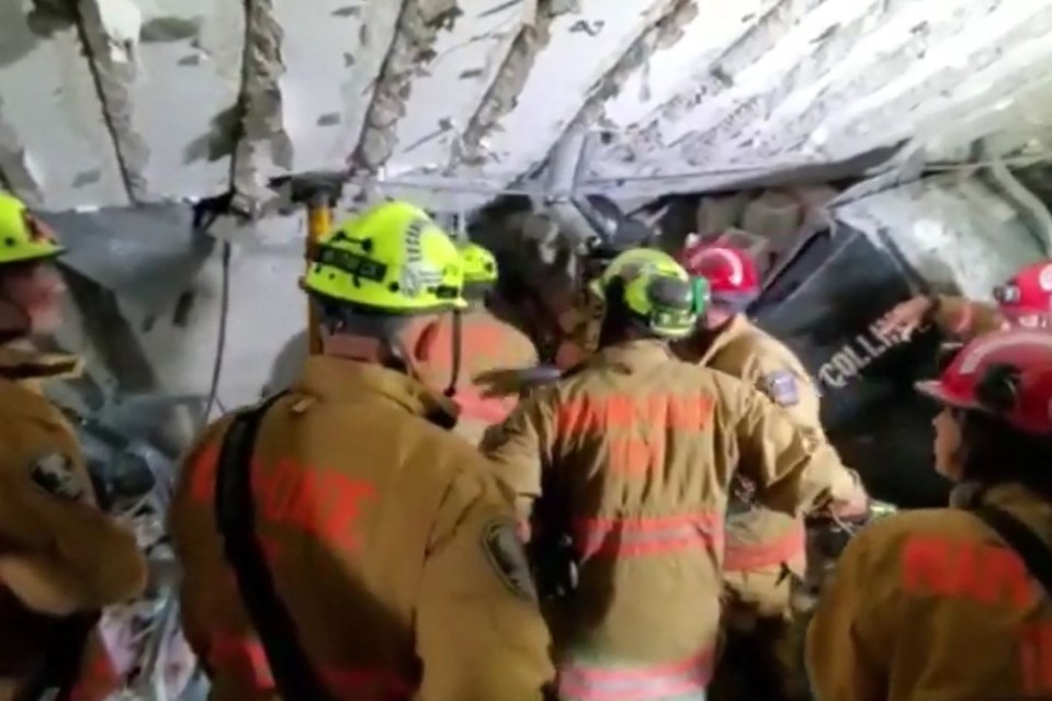 Cops branded the collapse site 'very unstable' as fire crews trawled through debris in the parking garage of the apartment complex