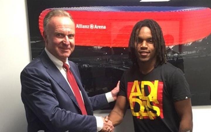 The teen shakes hands with Bayern chief Karl-Heinz Rummenigge after signing for the German giants