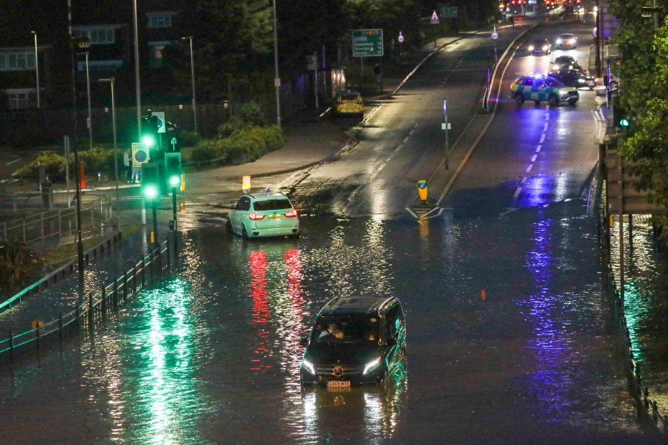 Cars were submerged after bouts of heavy rain in Dagenham