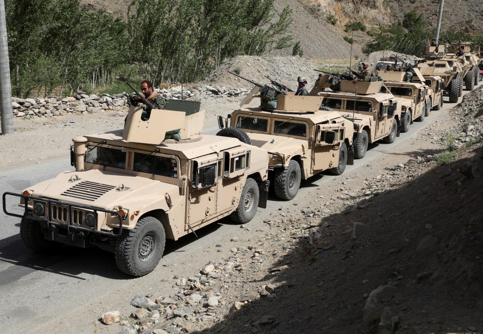 Afghan forces in an armoured convoy as they prepare to defend against the Taliban