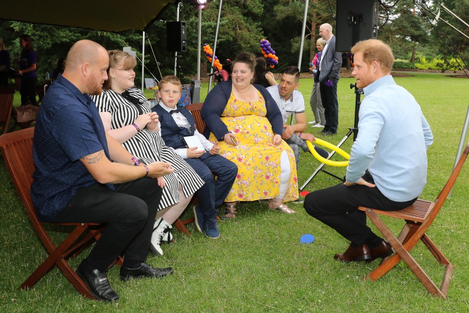 Prince Harry met with families on Wednesday at Kew Gardens, in London