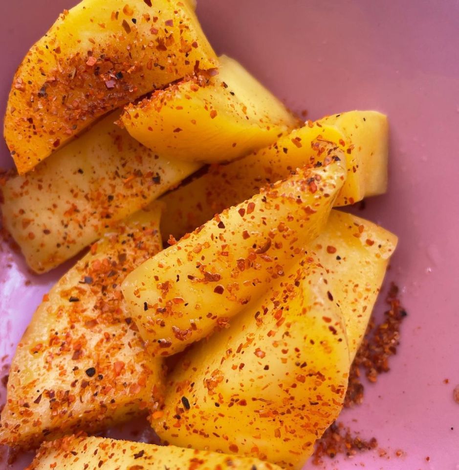 She also added a picture of a plate on chopped mangoes covered in chilli flakes