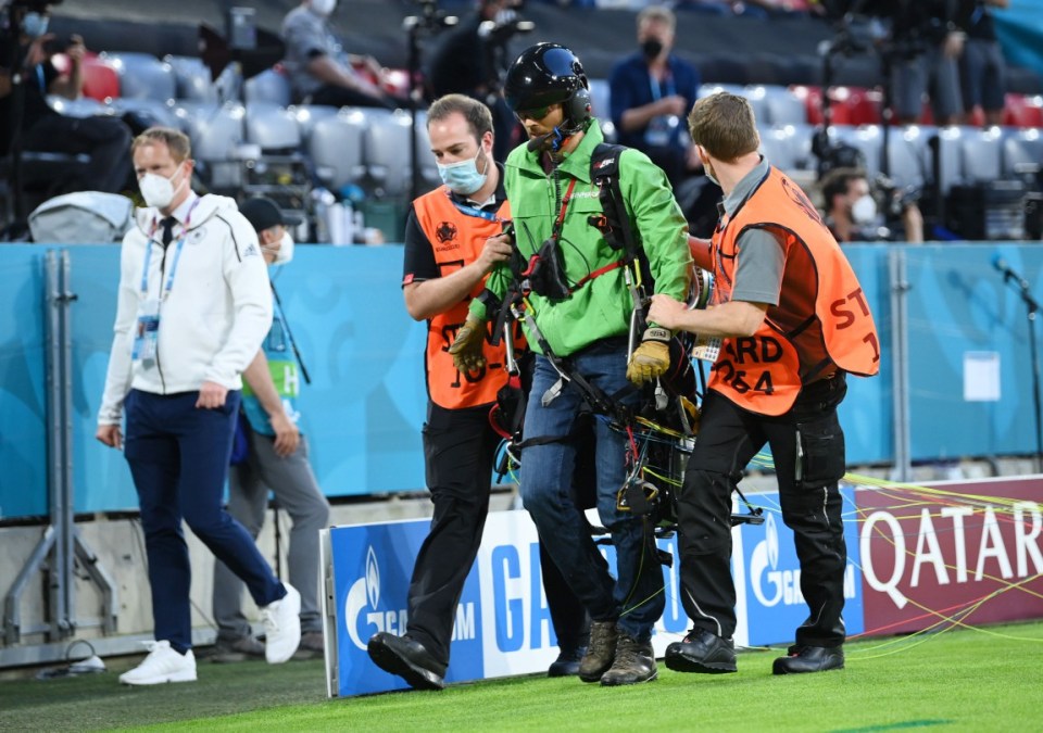 The protestor - reported to be from Greenpeace - was escorted from the pitch by stewards