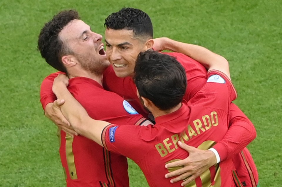 Ronaldo celebrates with teammates Diogo Jota and Bernardo Silva