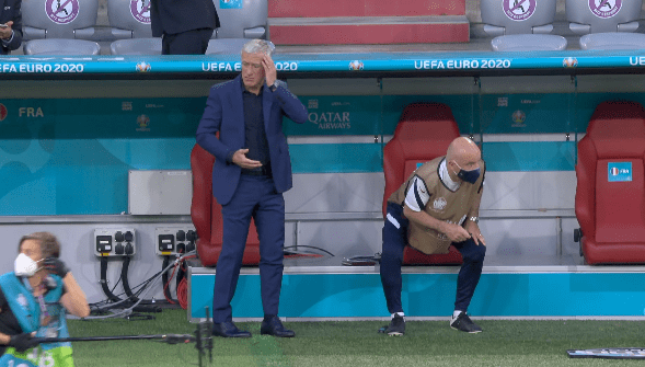 Didier Deschamps had to take cover under the dugout due to falling debris