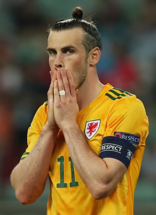 Gareth Bale reacts to his spectacular spot-kick miss