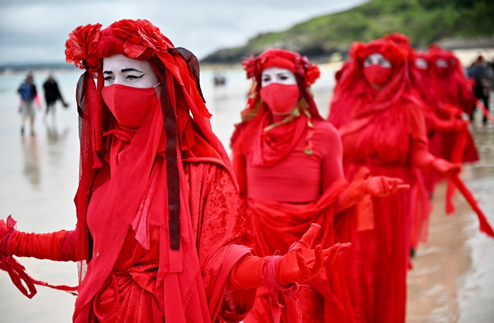 'Red Rebels' activists take part in the 'Sound The Alarm' march