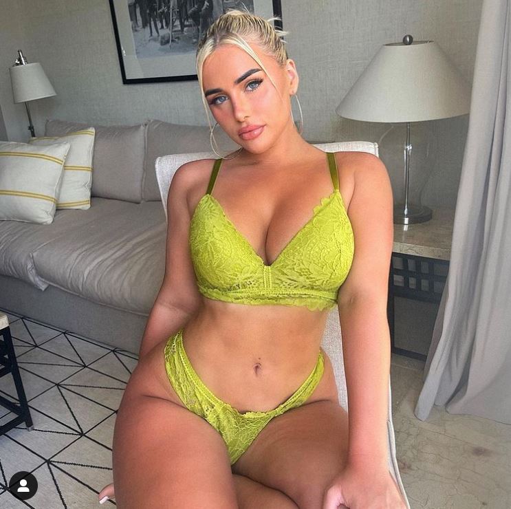 Ellie grabs fans attention posing in racy neon lime green lingerie