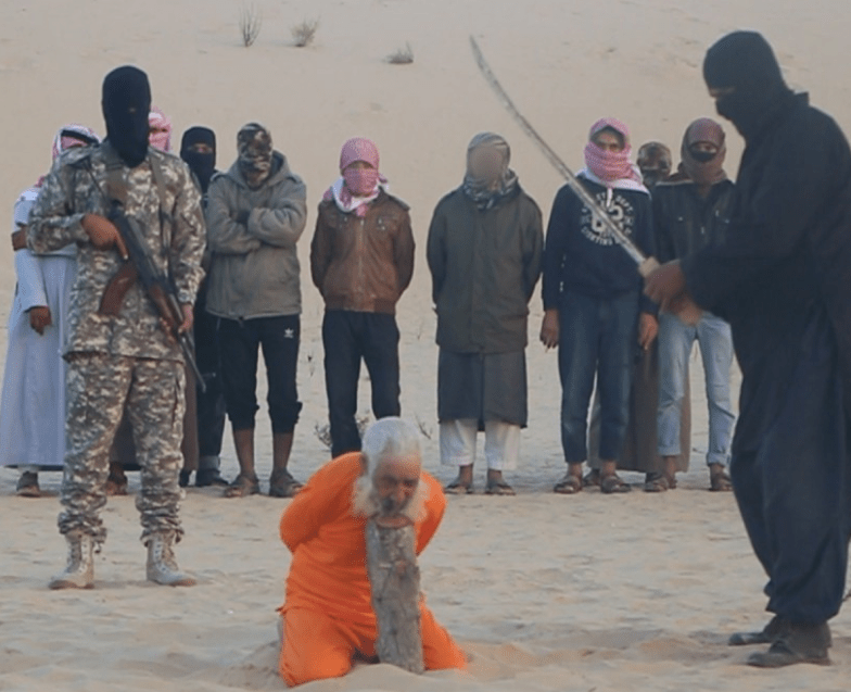 ISIS fighters behead a man accused of 'witchcraft' - making sure to get it all on film