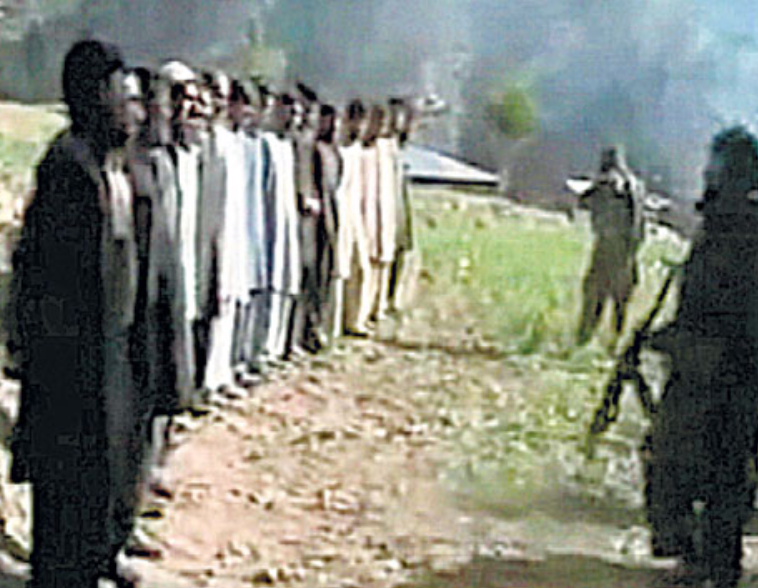 Taliban fighters line a group of men up to be shot by AK-47 for being 'enemies of Islam'