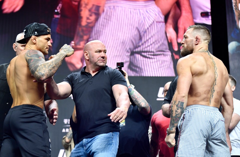 Dustin Poirier and Conor McGregor face off during the ceremonial UFC 264 weigh-ins