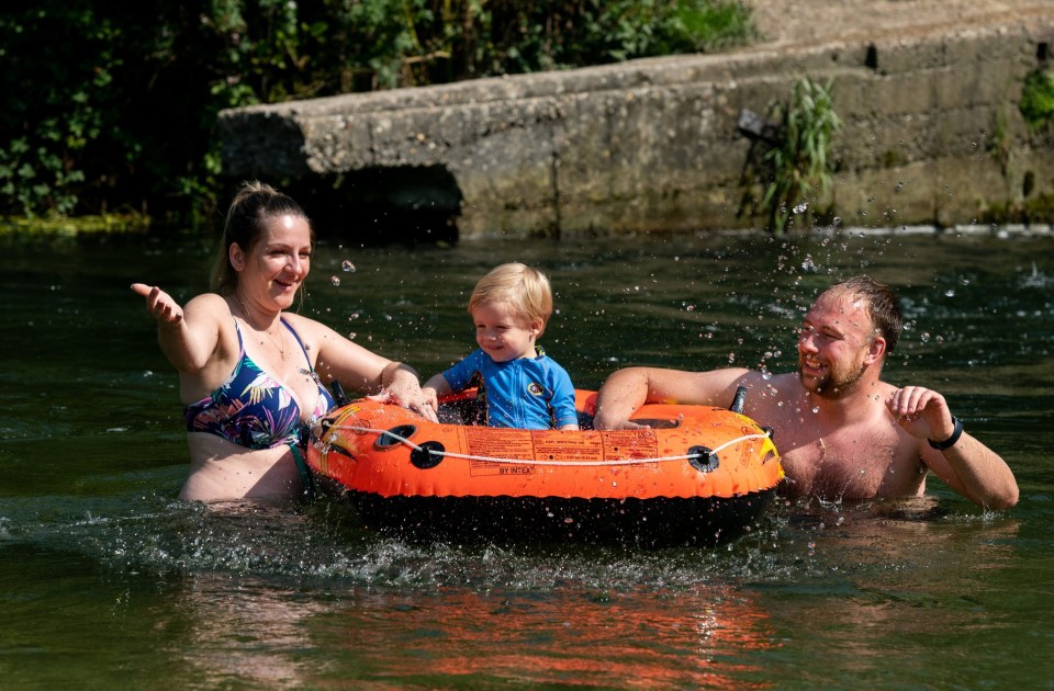 Michael and Patrycja Plodowski with their two-year-old son Anthony at Compton Lock in Winchester, Hants