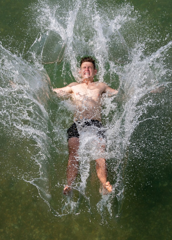 A swimmer makes a splash at Lymington Sea Water Baths, Hants