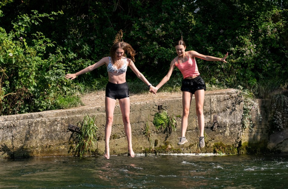 Friends Amelia Eyres and Erin Scambler jumped into the water at Compton Lock in Winchester, Hants