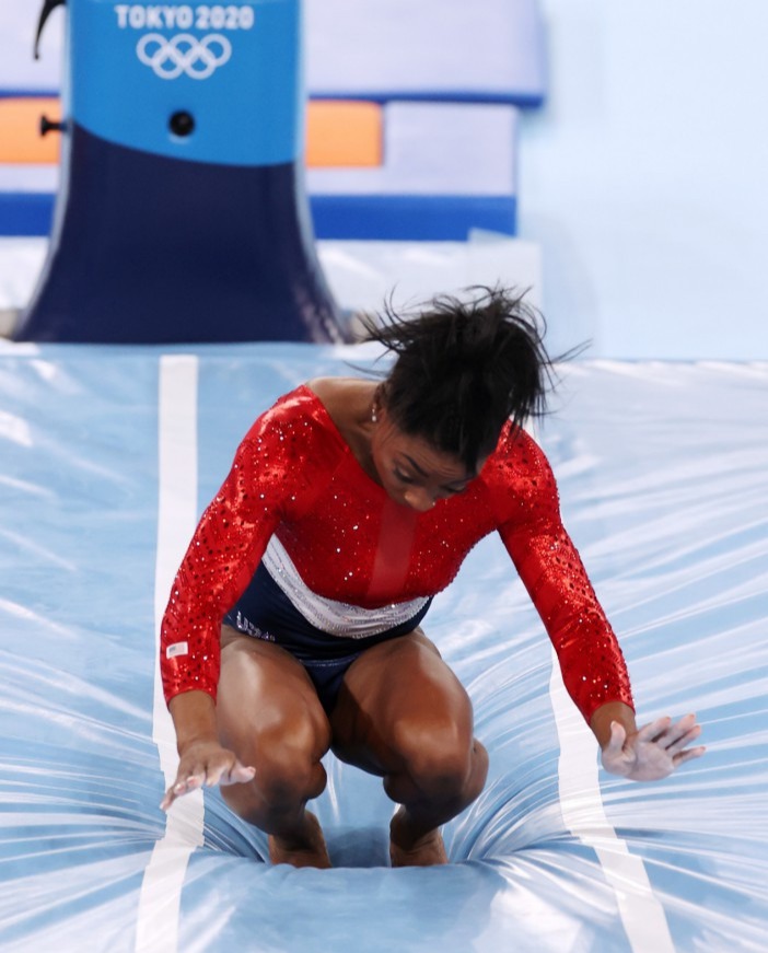 Biles left the competition floor after her error on the Vault