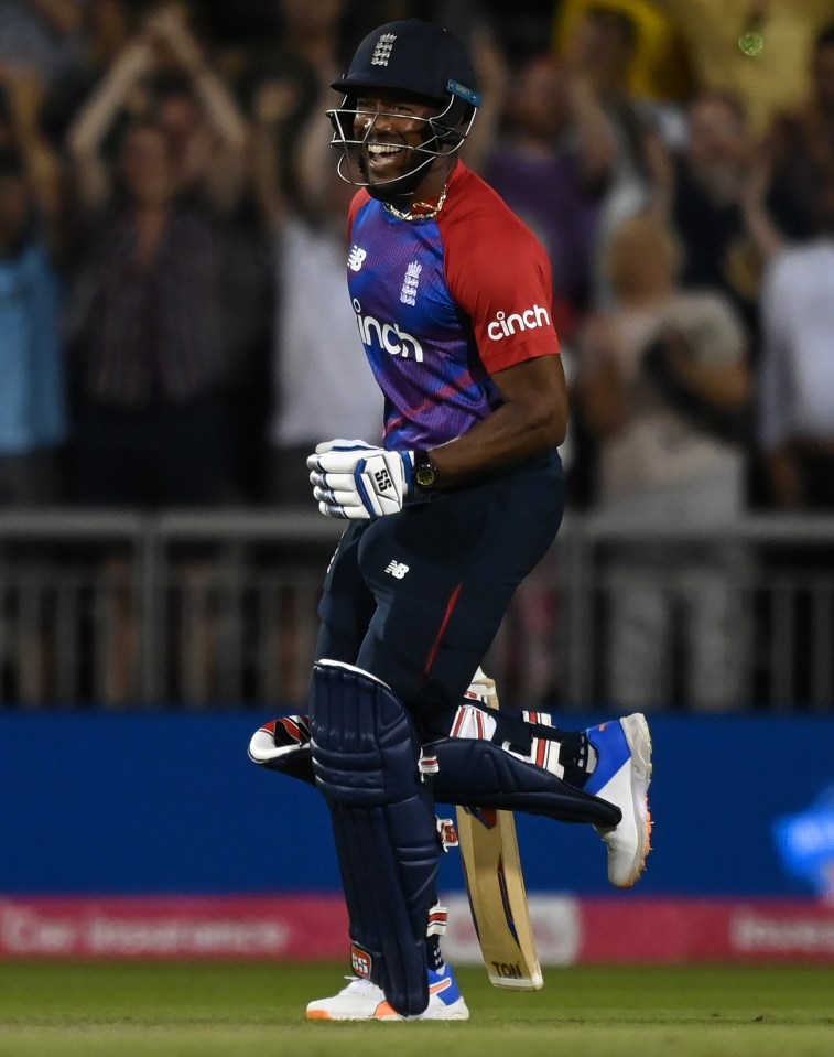 Chris Jordan celebrates securing victory for England