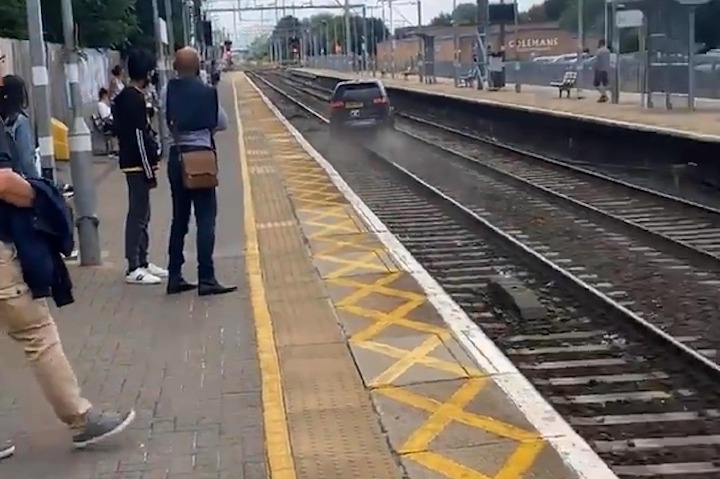 But it sped off while officers were trying to talk to the driver before ploughing onto train tracks past baffled commuters