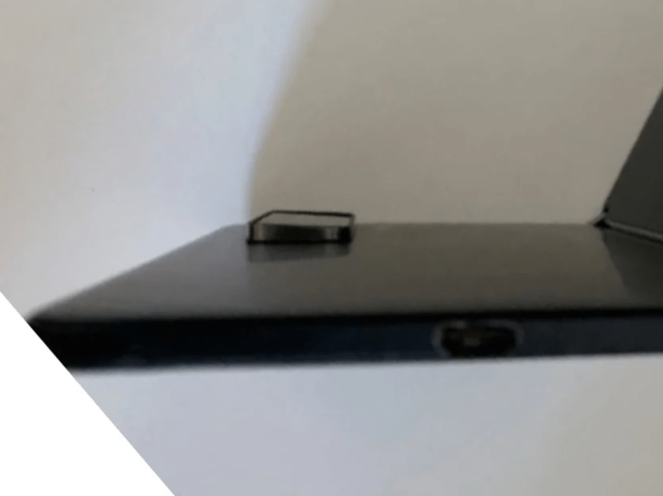 The device pictured in the photos looks much the same as the original Surface Duo but with a heft camera bump on the back