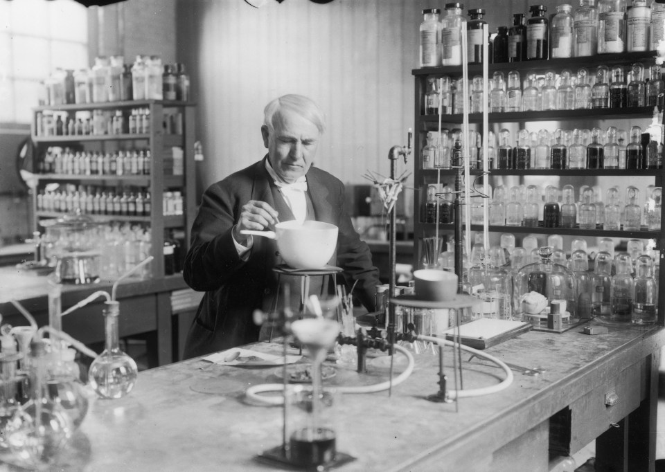 American inventor Thomas Edison (1847 – 1931) conducting an experiment in his laboratory