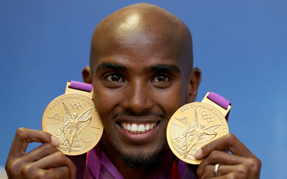 Mo Farah poses with his 5,000 and 10,000 metre gold medals from London 2012