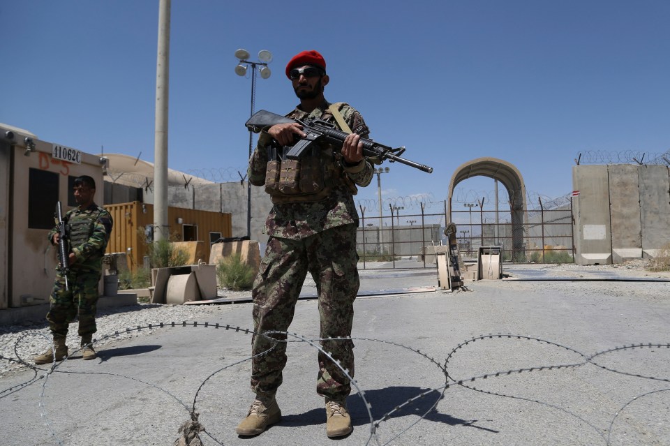 An Afghan National Army (ANA) soldier stands guard at Bagram Air Base