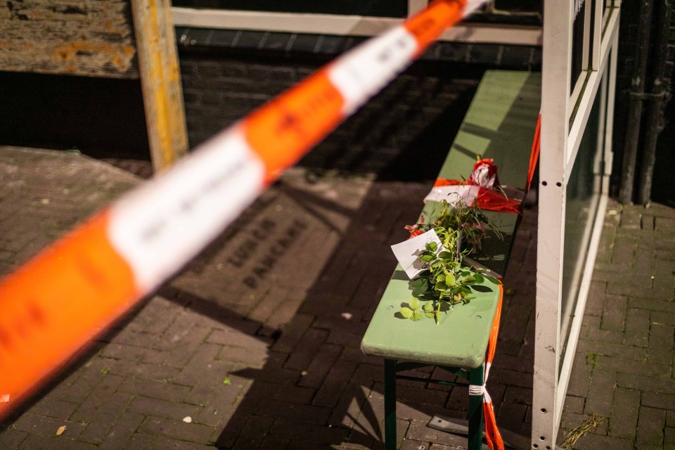 Flowers have been left near the street where the journalist was shot five times