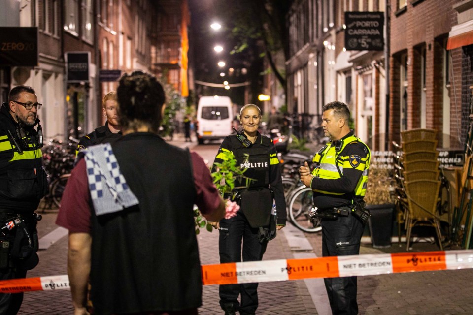 Police officers at the scene of the shooting in Amsterdam