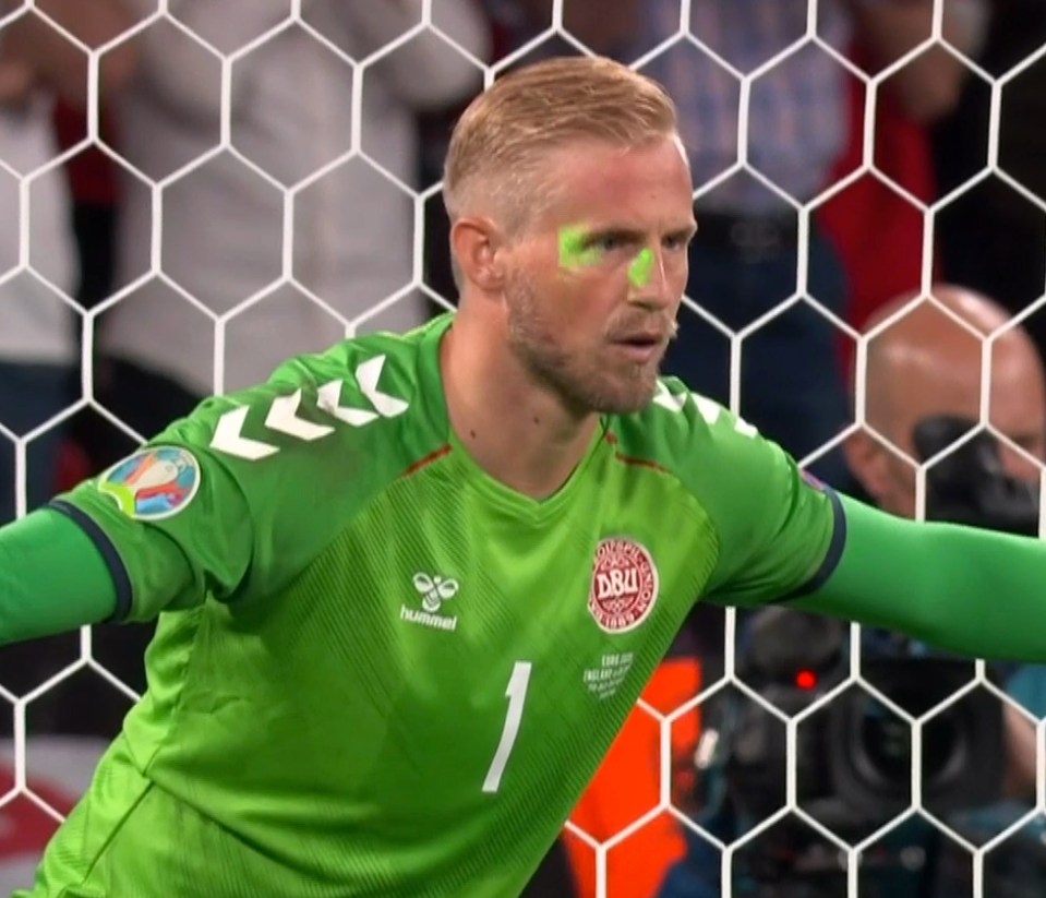 He apologised to Denmark after a fan shone a light in Schmeichel's eyes