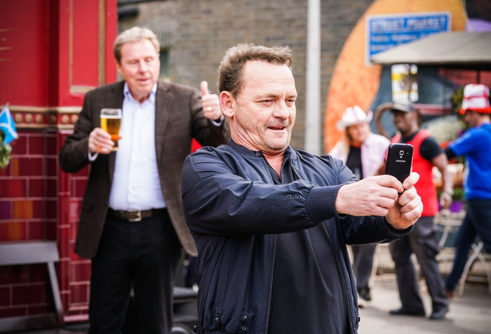 Harry was seen enjoying a drink in Walford's square with friend Rocky