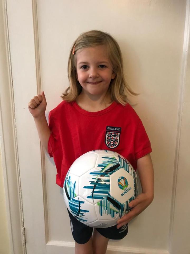 Anna Roberts, aged six, says her Arsenal-supporting dad has to cheer on Harry Kane