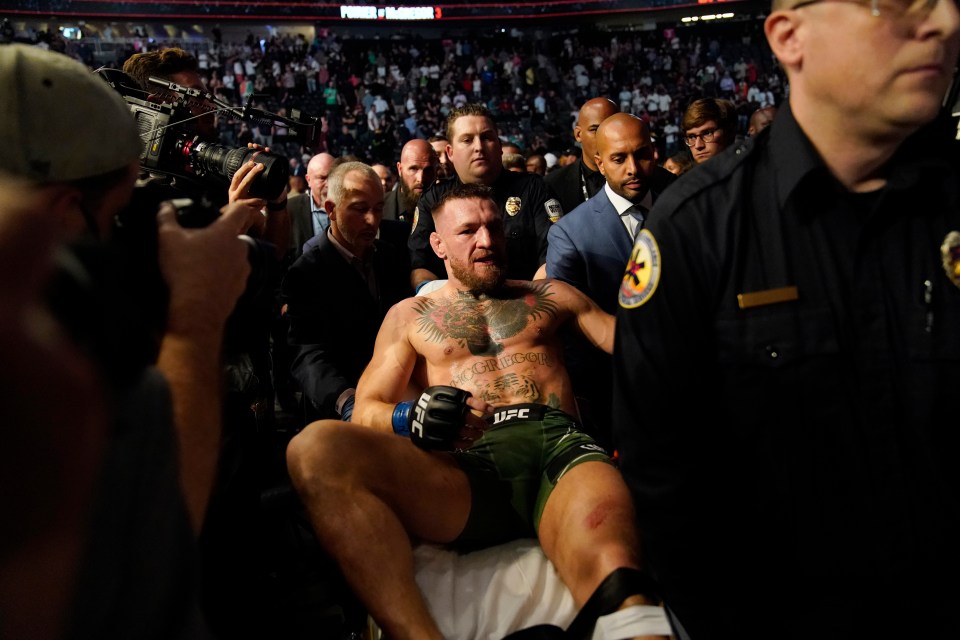 Conor McGregor was carried out of the arena after breaking his tibia against Dustin Poirier